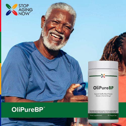 View 6 Older Black man smiling outdoors while holding a bottle of OliPureBP, showcasing a healthy lifestyle and supplement choice.