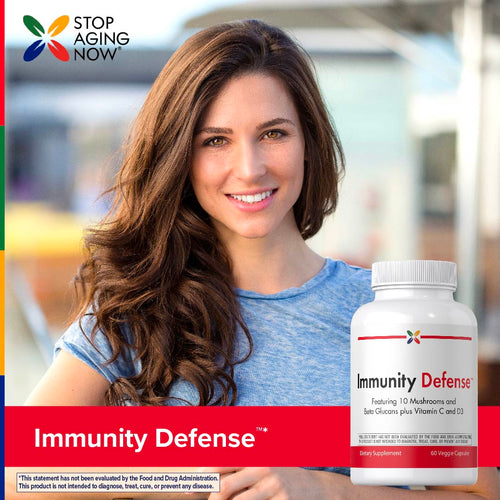 View 7 Woman holding a bottle of 'Immunity Defense' supplement with 'Stop Aging Now' branding.