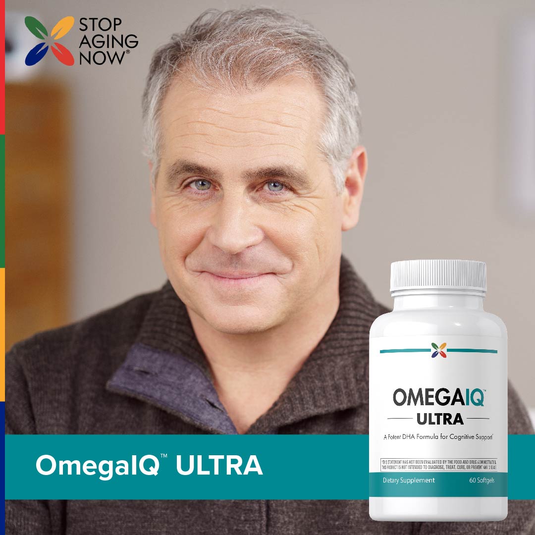 A cheerful middle-aged man stands next to an OmegaIQ ULTRA bottle.